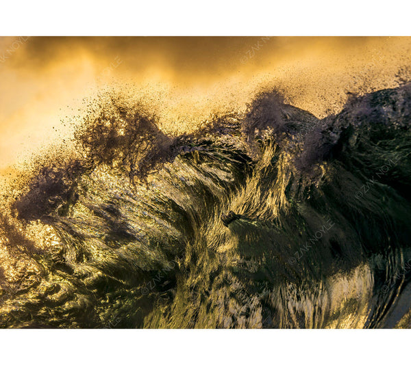 Ocean mist rushes off the top of this wave image