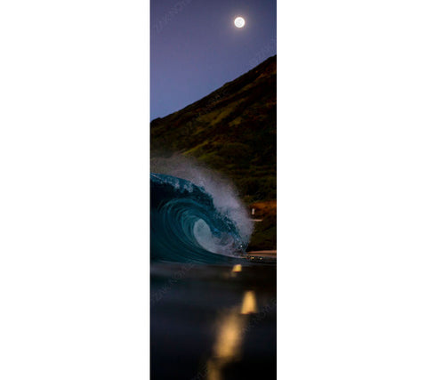 Panoramic photo of the moon reflecting over a wave