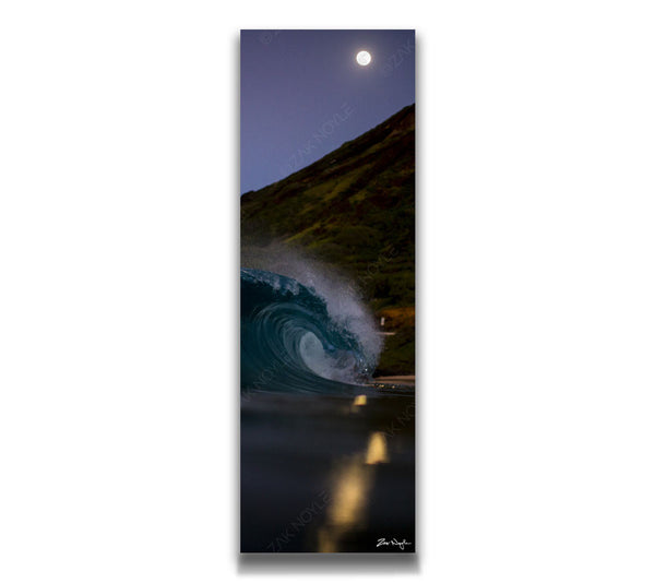 Vertical panoramic night image of moon reflecting off ocean