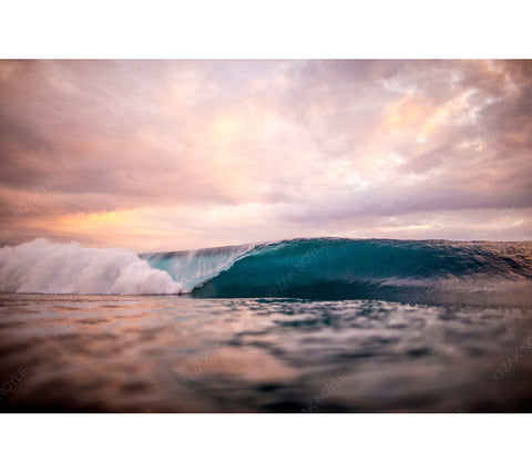 Image of the sun setting over the ocean