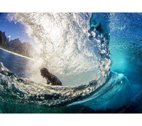 Image of a surfer in Tahiti