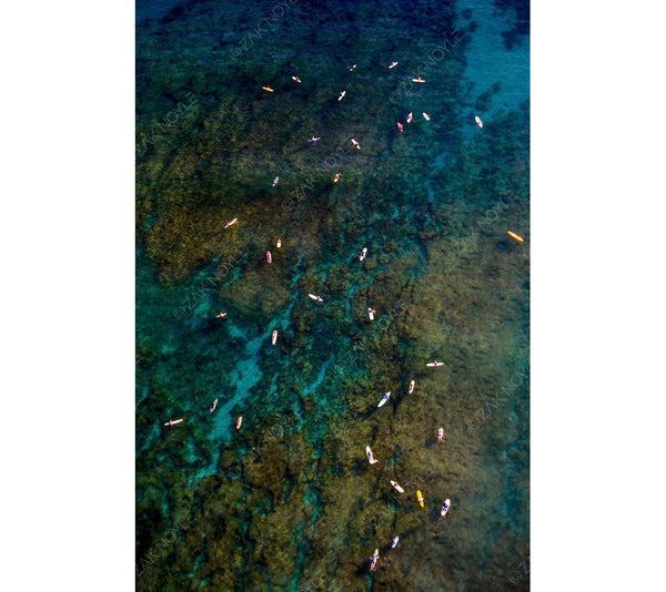 Aerial image of surfers in the water off of Waikiki